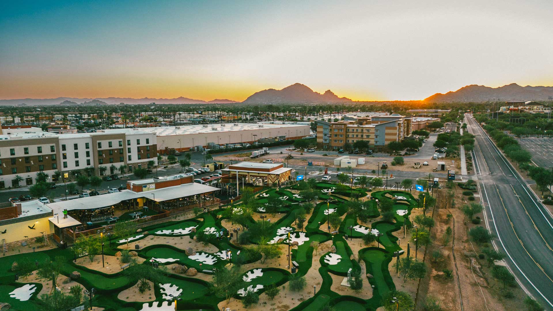 Aerial view of PopStroke Scottsdale putting courses at sunset